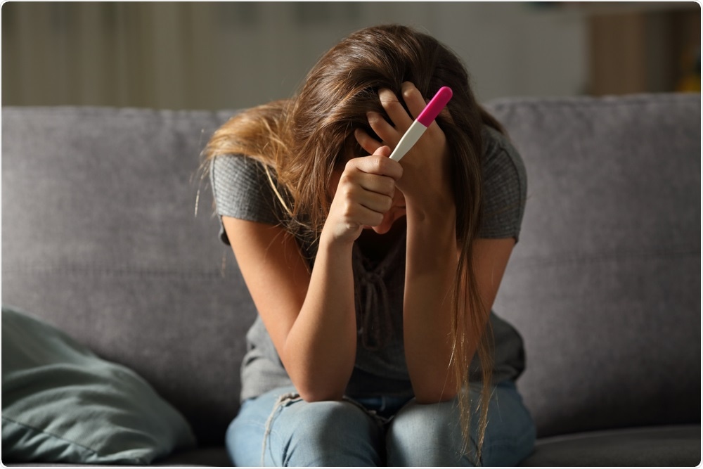 Woman with pregnancy test Woman with pregnancy test