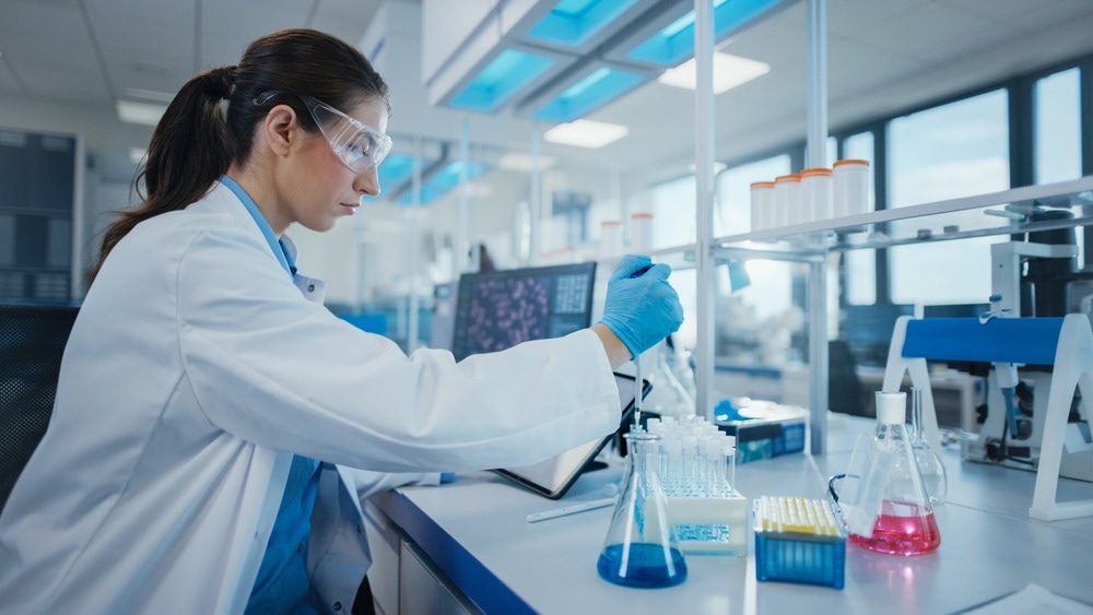 Modern Medical Research Laboratory: Female Scientist Working with Micro Pipette, Analysing Biochemicals Samples. Advanced Scientific Lab for Medicine, Microbiology Development.