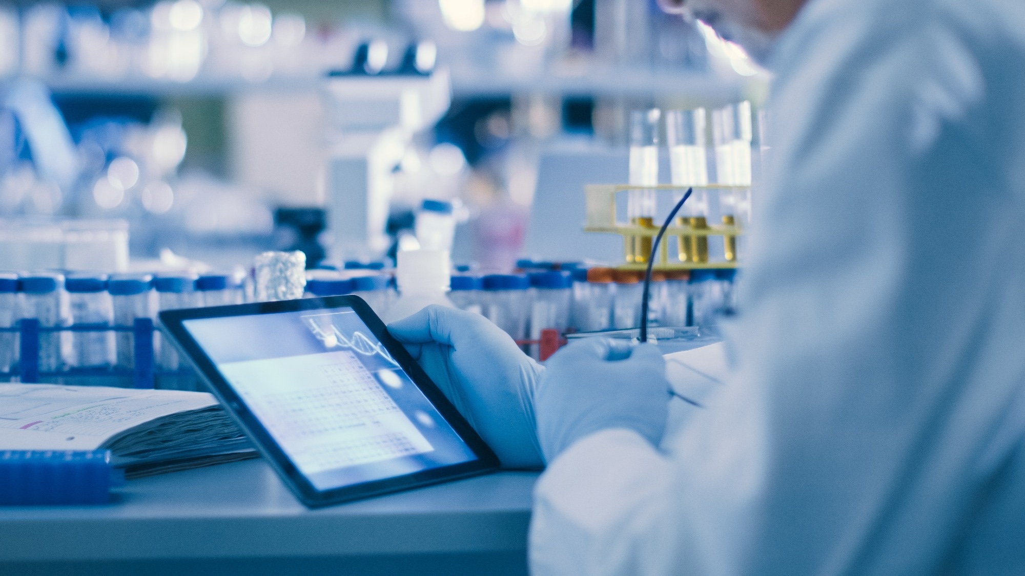 Senior Male Research Scientist is Using a Tablet Computer in a Modern High-Tech Laboratory.