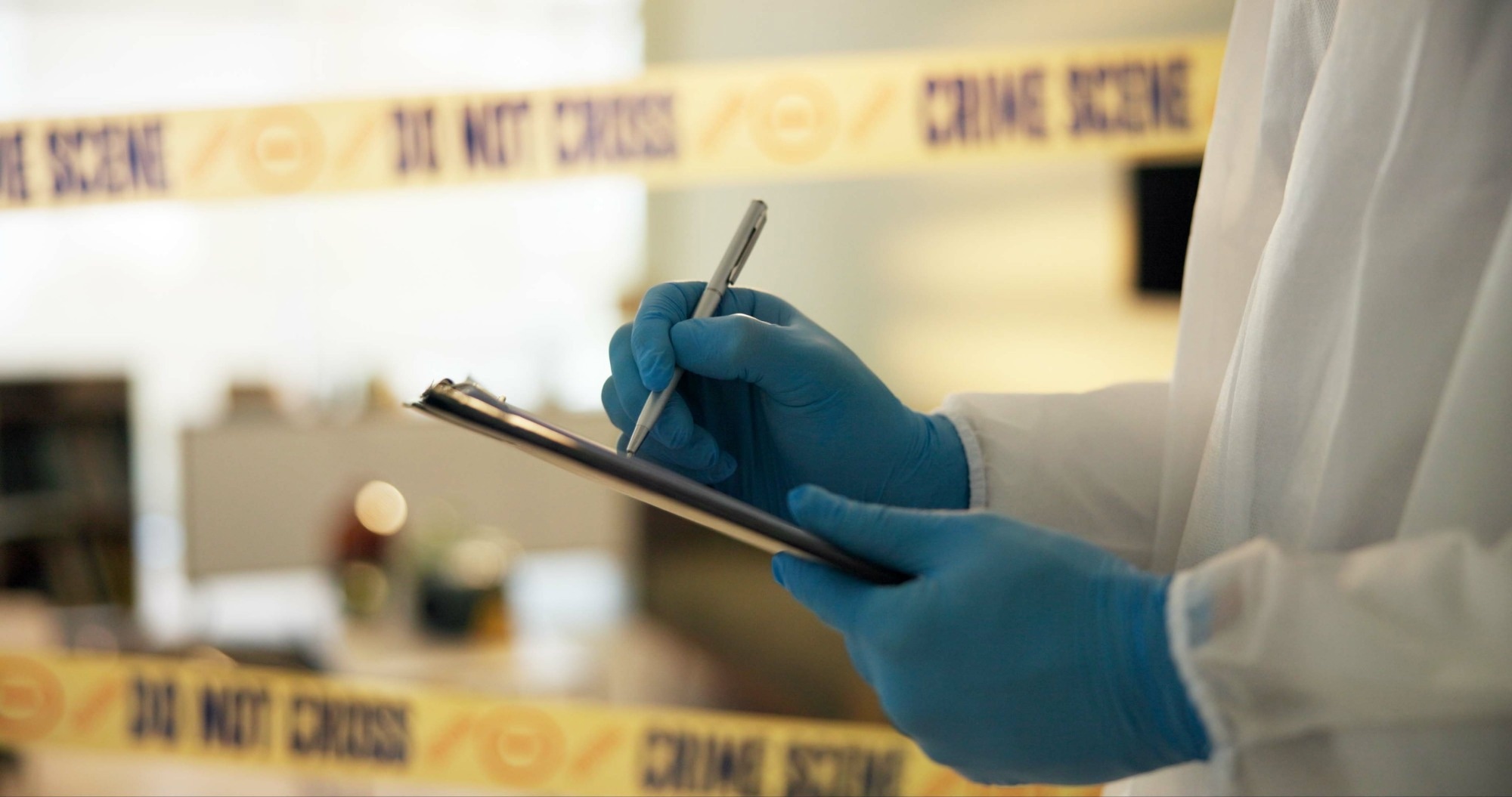 Hand, house and crime scene with writing for evidence or notes in robbery for evidence, safety and report.
