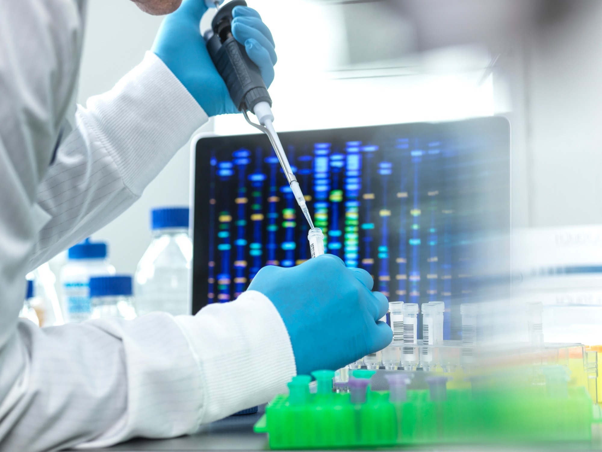 Scientist pipetting sample into a vial.