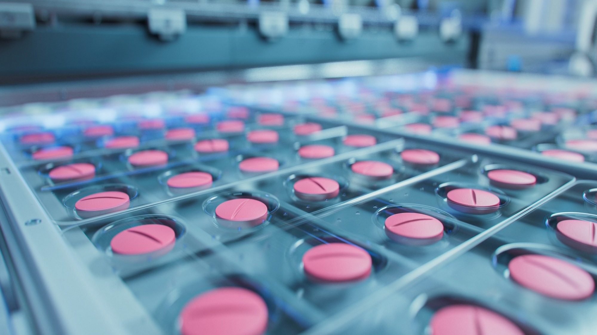 Macro Shot of Pink Pills During Production and Packing Process on Modern Pharmaceutical Factory