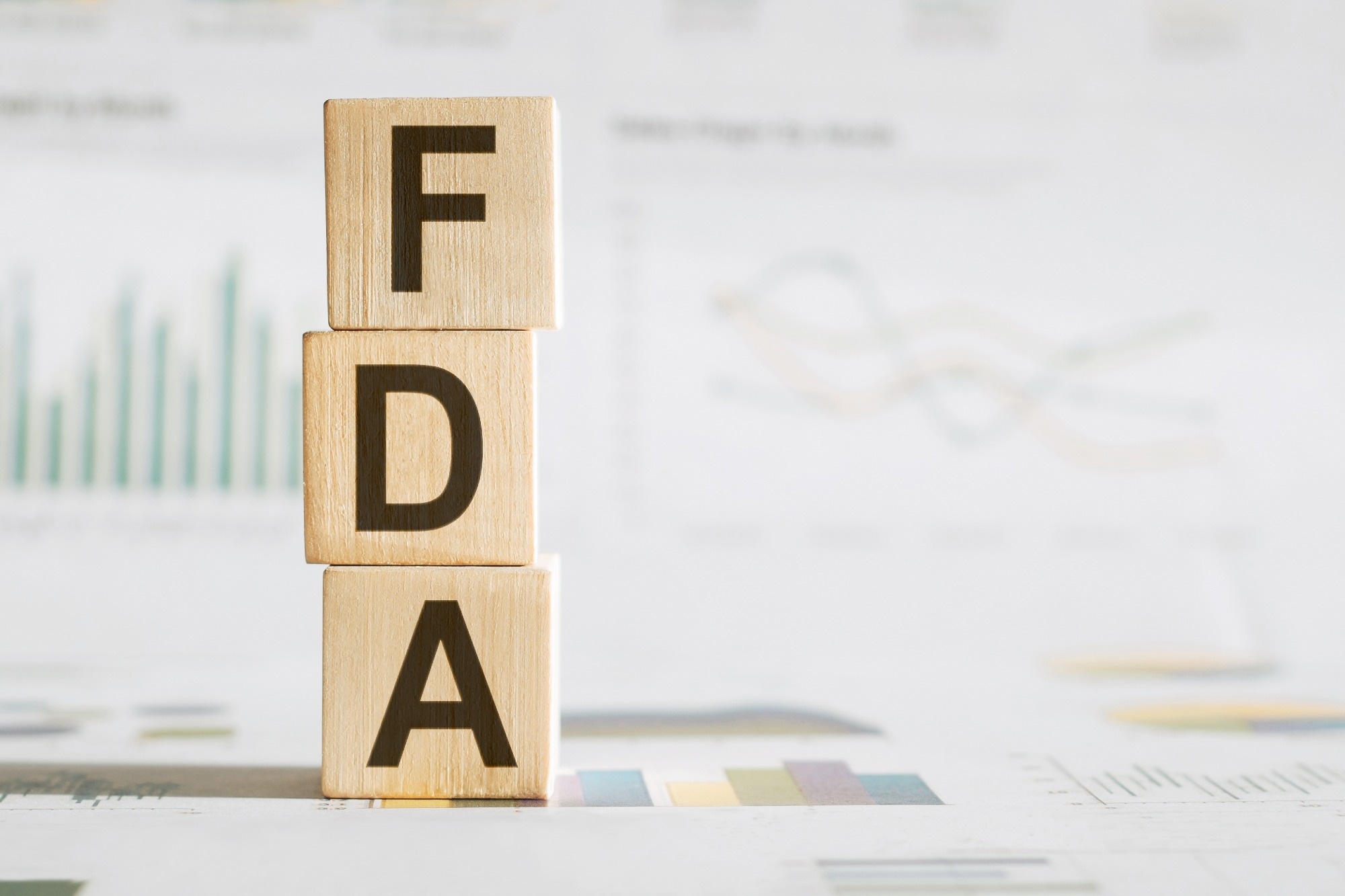 FDA written on wooden cube with chart.
