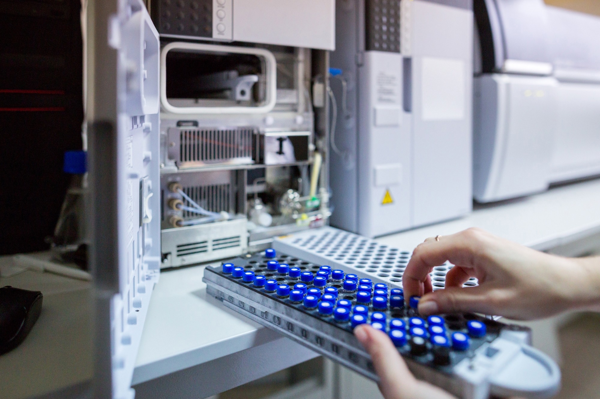The laboratory scientist prepares samples for download to High-performance Liquid Chromatograph Mass Spectrometer.