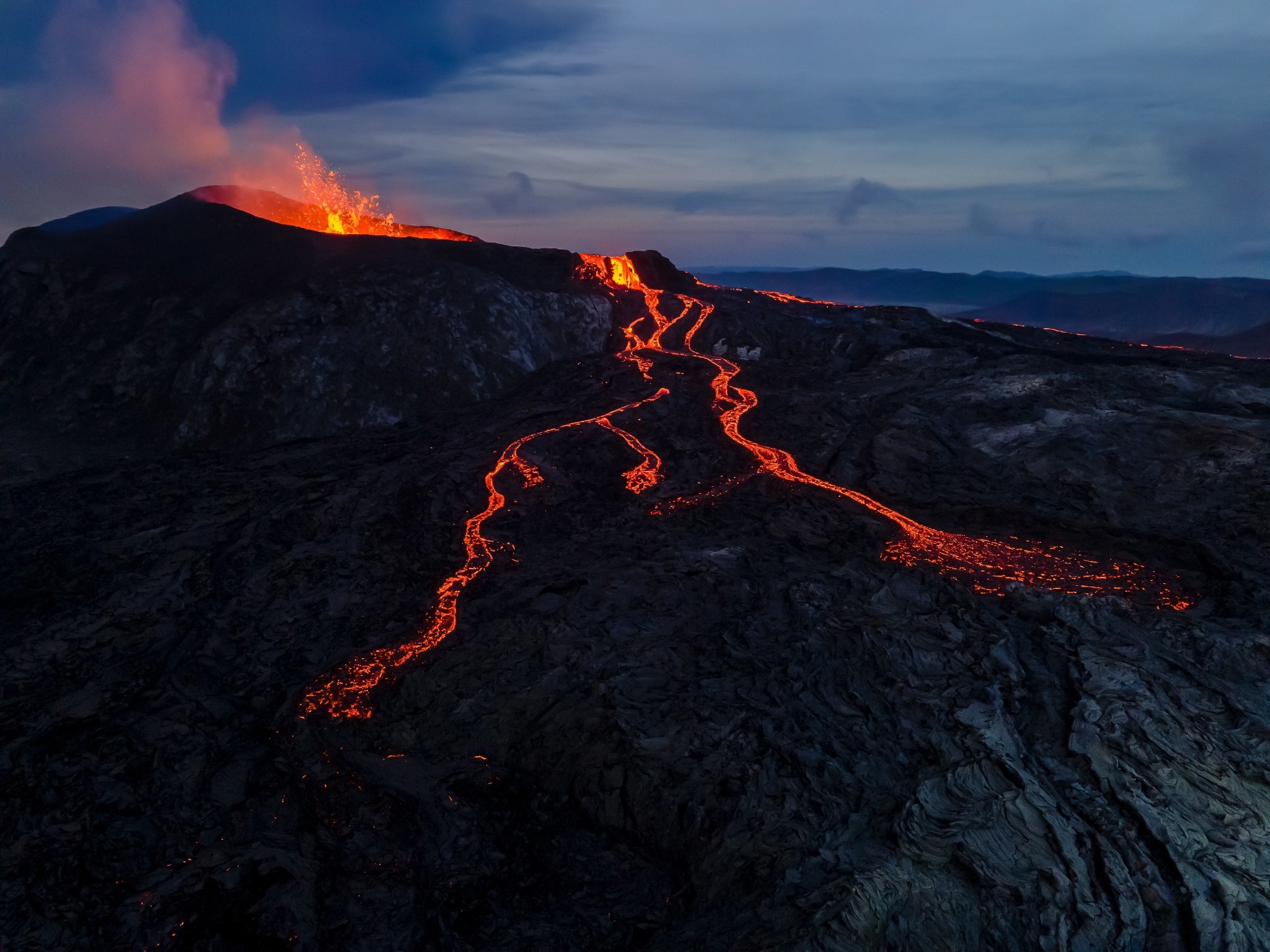 Impressive aerial View of the active volcano explosions of lava and magma rivers in Iceland