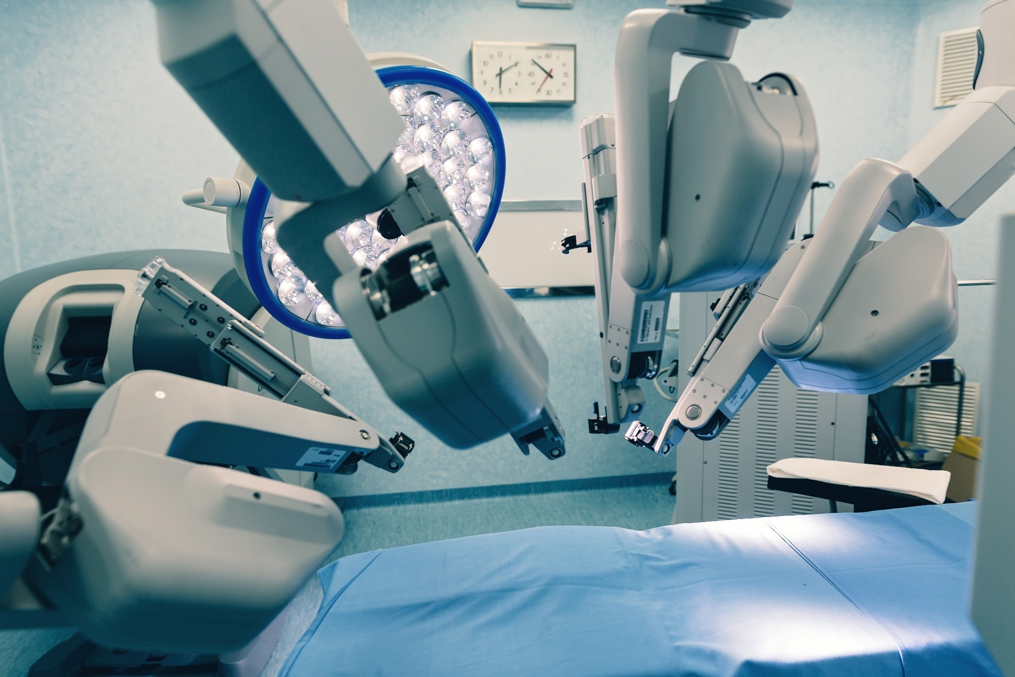 Surgical room in hospital with robotic technology equipment, machine arm surgeon in futuristic operation room