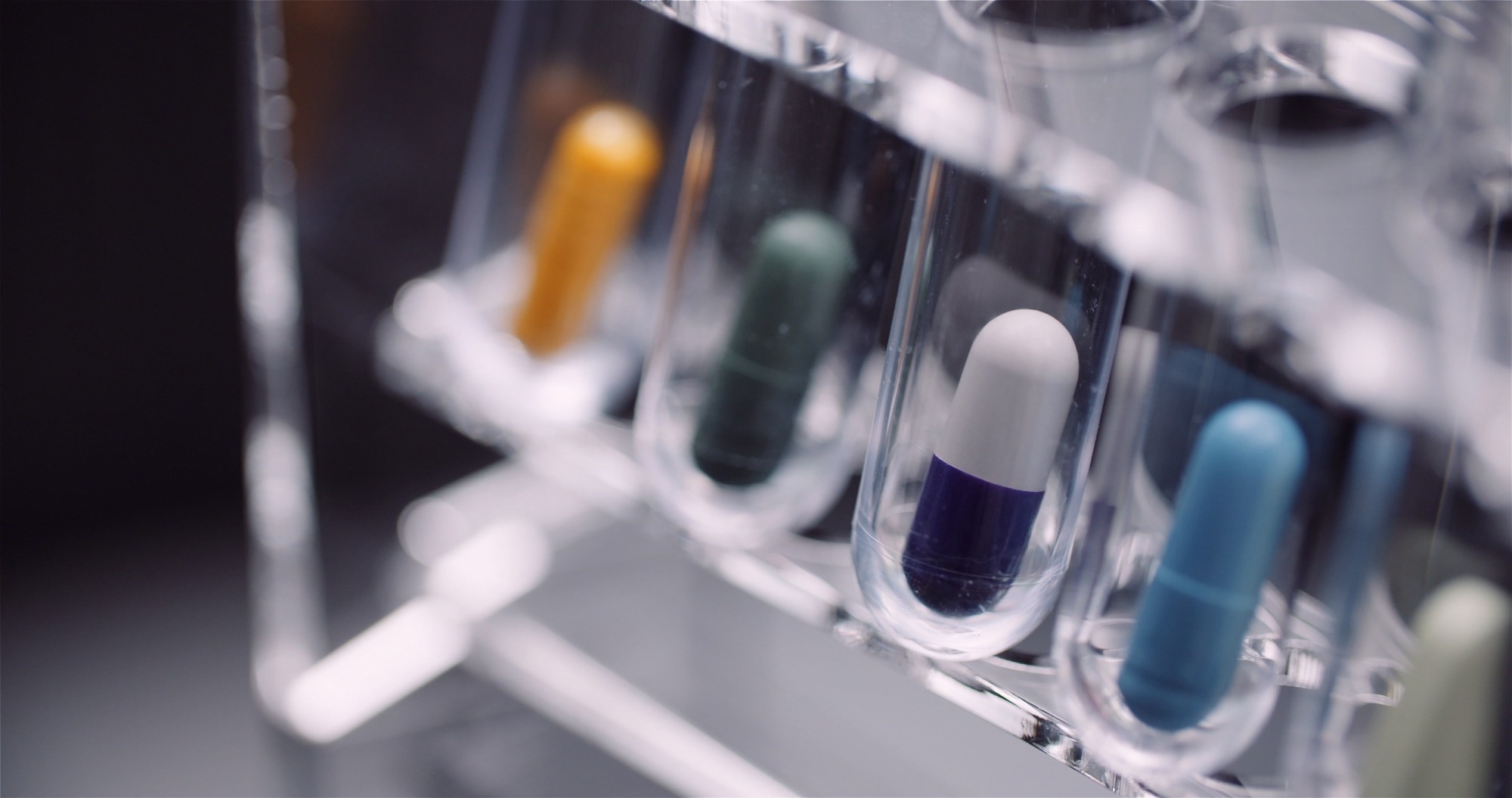 Extreme Close up of Test Tubes Filled with Pills and Drugs.