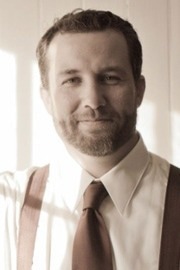 Black and white image of Kyle James.