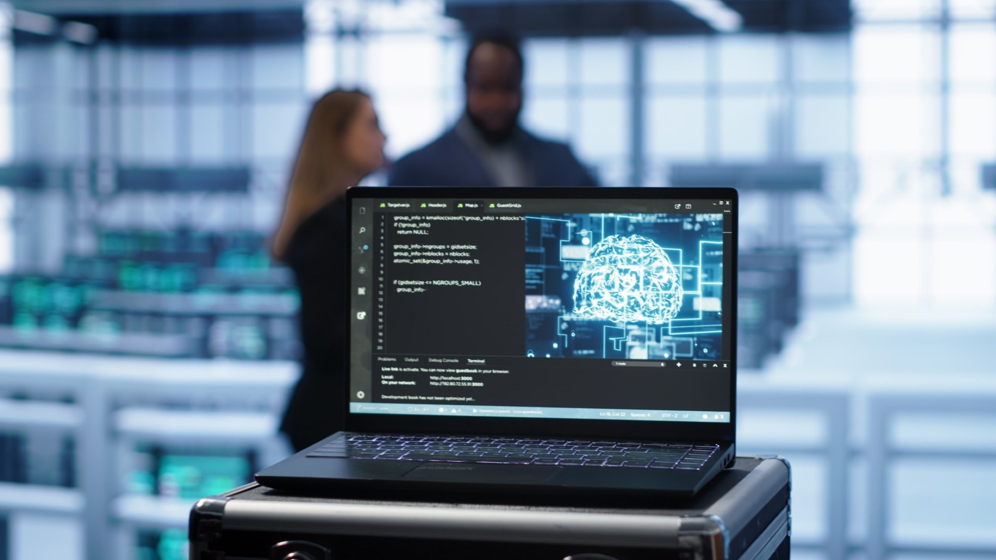 Focus on notebook used by engineers in server hub in blurry background using artificial intelligence computerized model.