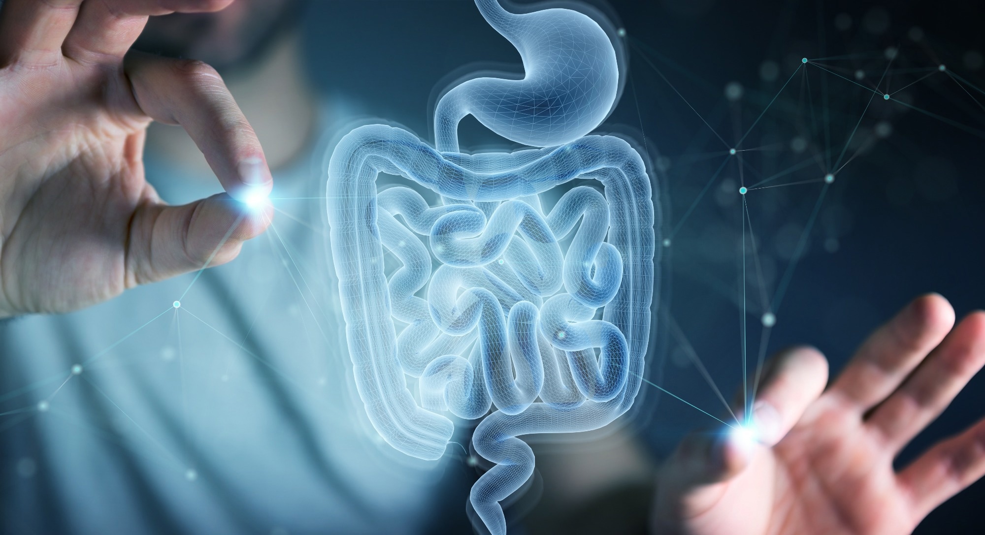 Man on dark background using digital x-ray of human intestine