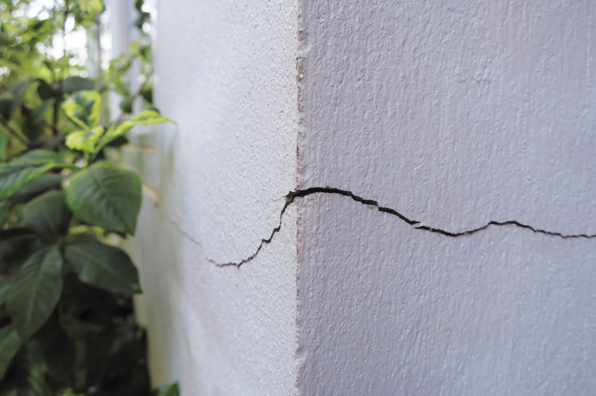 Crack concrete building broken wall at the outside cement corner