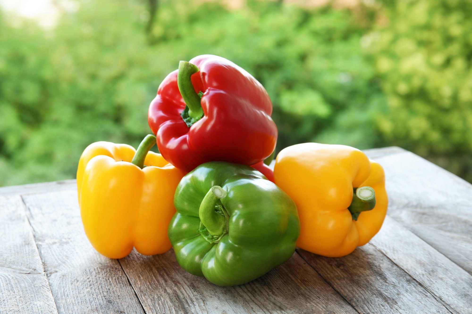 Raw ripe paprika peppers on table